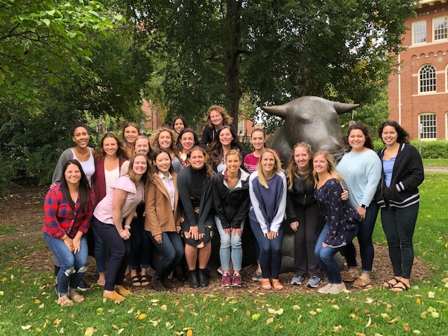 interns standing in front of st paul bull statue